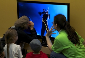 Visitors at the event explore 3-D television. (Photo: Raymond Sanchez) Visitors at the event explore 3-D television. (Photo: Raymond Sanchez)